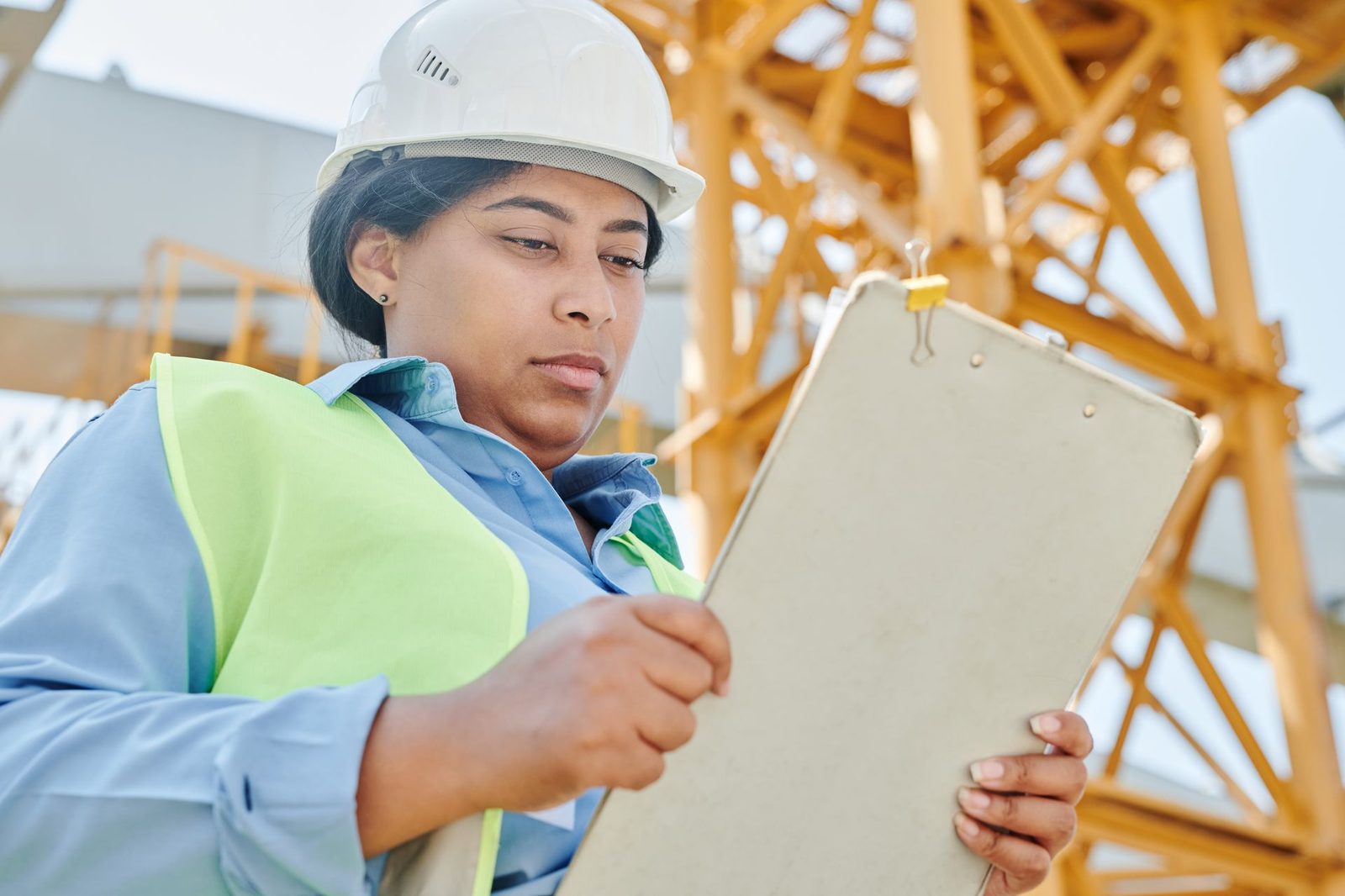 Inspector with a clipboard carrying out a safety certification check
